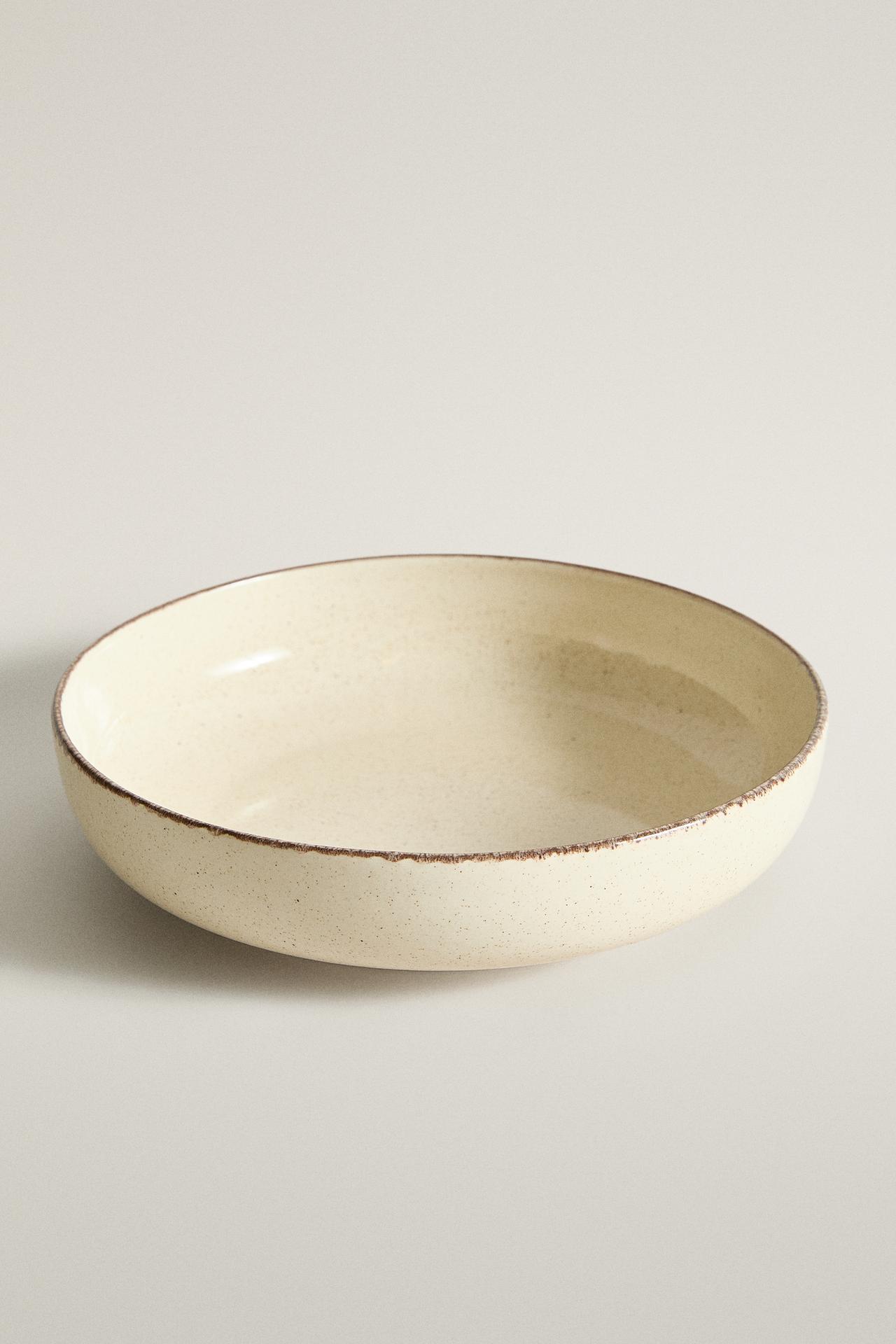 STONEWARE SOUP PLATE WITH AGED RIM — Light ecru