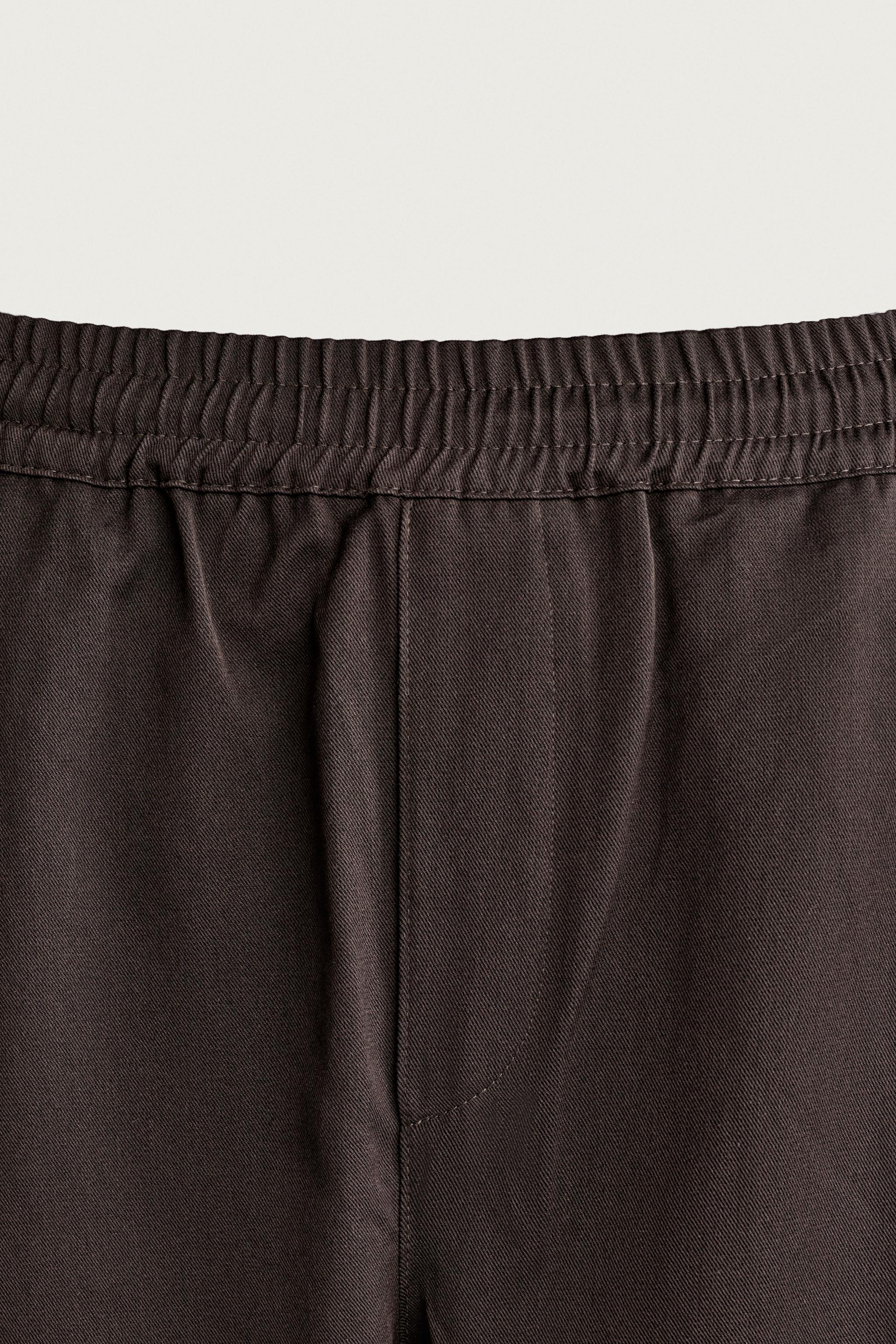 SIDE-PLEAT BALLOON FIT TROUSERS