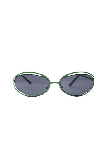 Sunglasses with dark oval lenses and a thin green frame with double top rim detail on a white background.