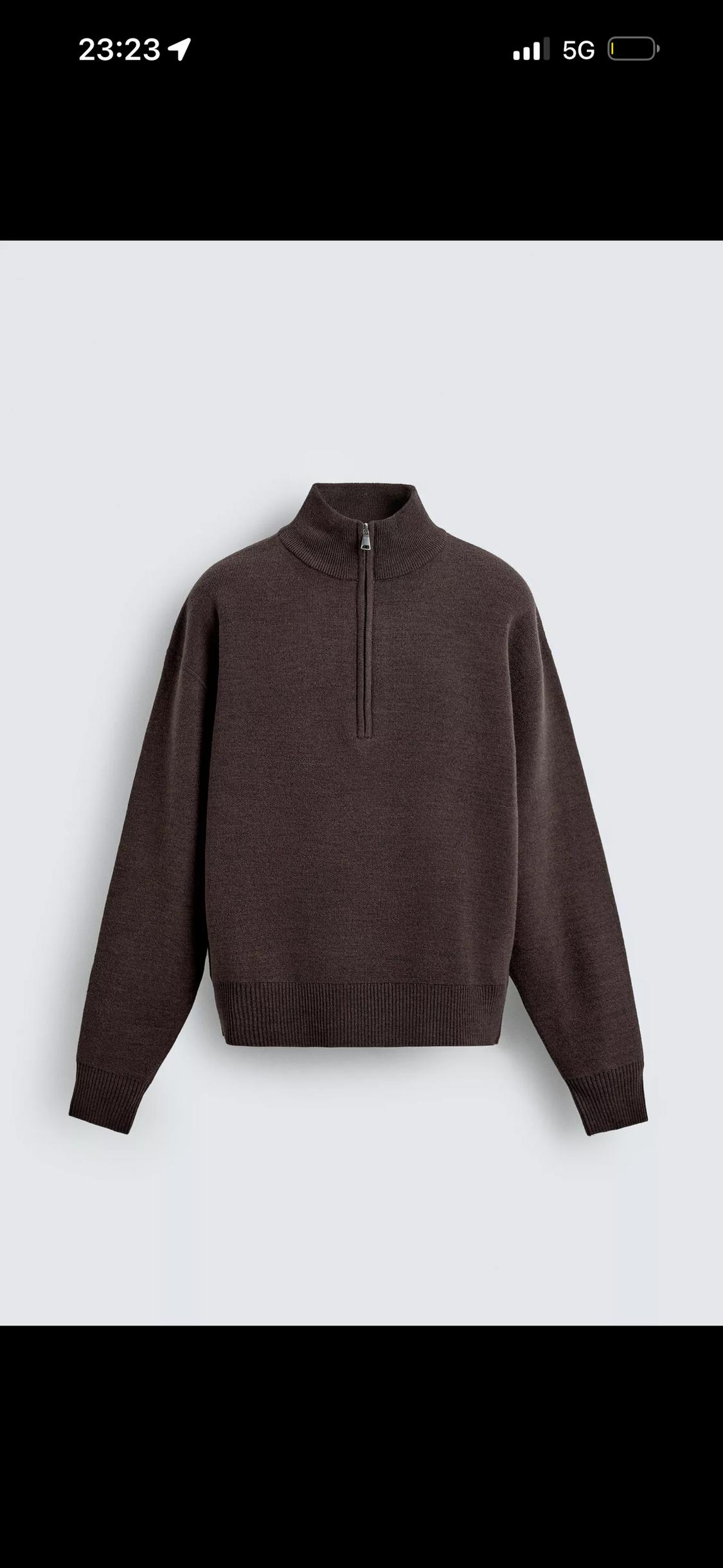 Dark brown knitted jumper with a high collar and half-zip on a light background. Text: 23:23 5G.