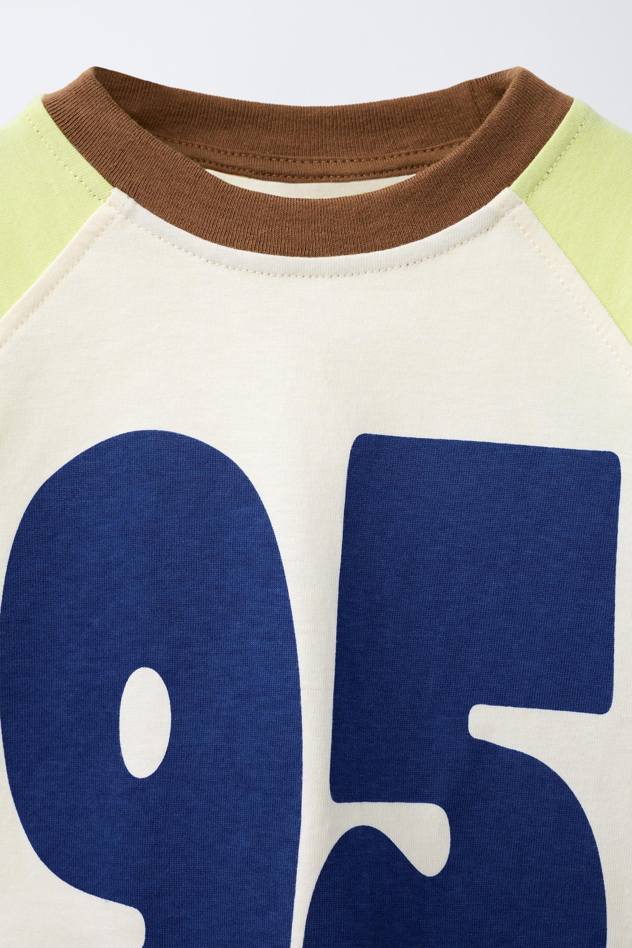 NUMBERED RAGLAN SLEEVE T-SHIRT