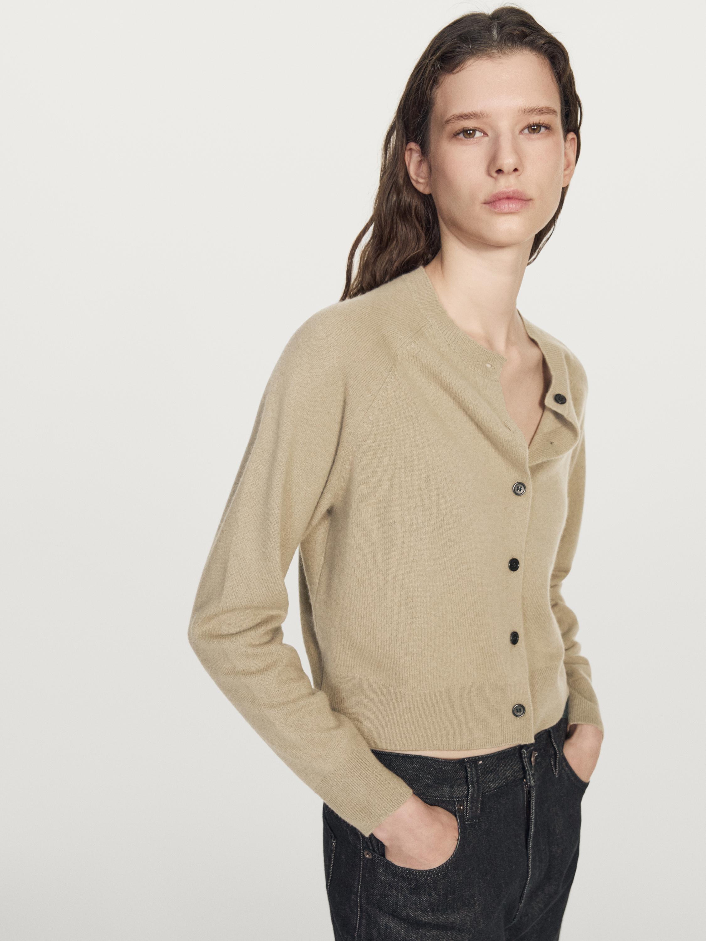 Short knit cardigan with raglan sleeves