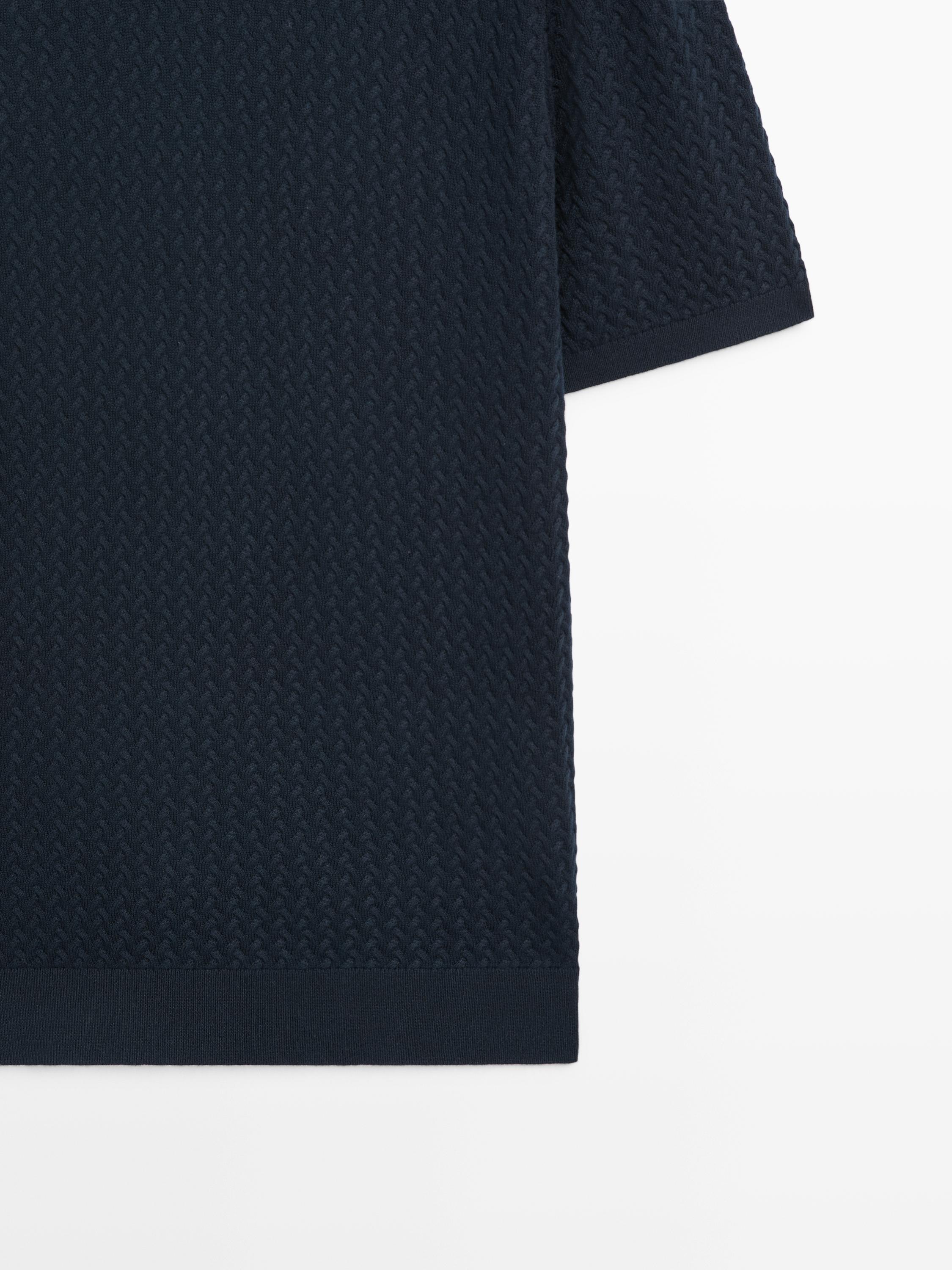 Polo en maille torsadée à col V