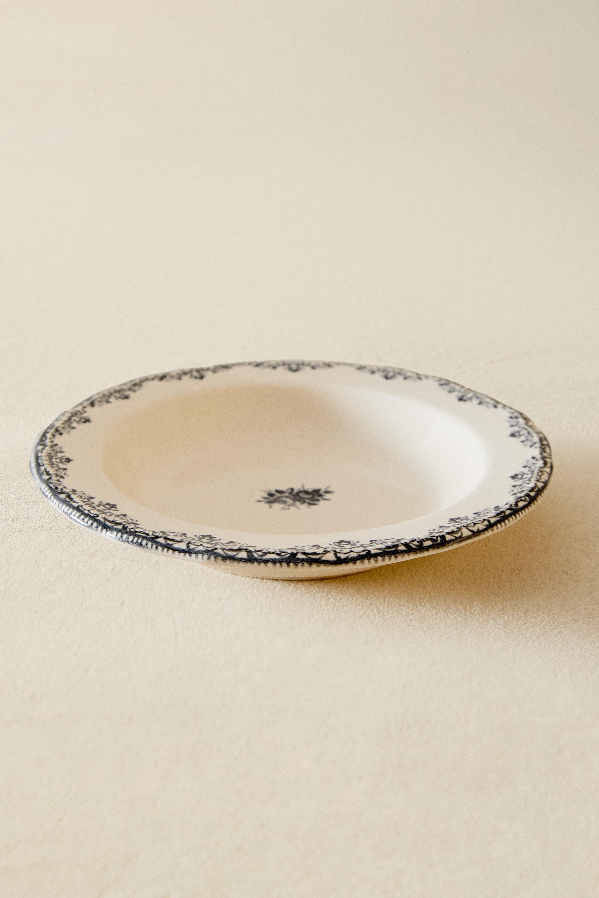 EARTHENWARE SOUP PLATE WITH PLACED DESIGN