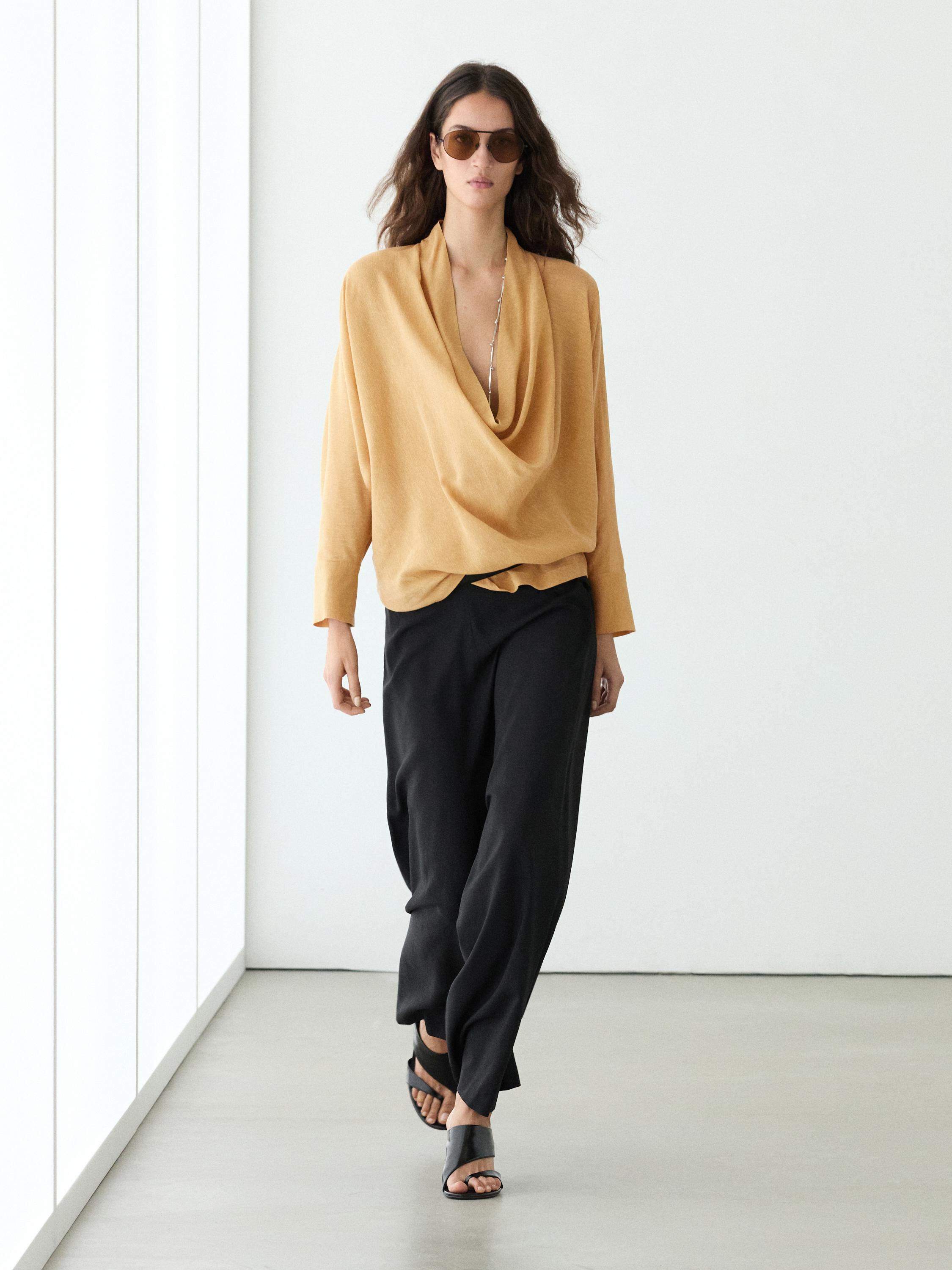 Flowing blouse with draped neckline
