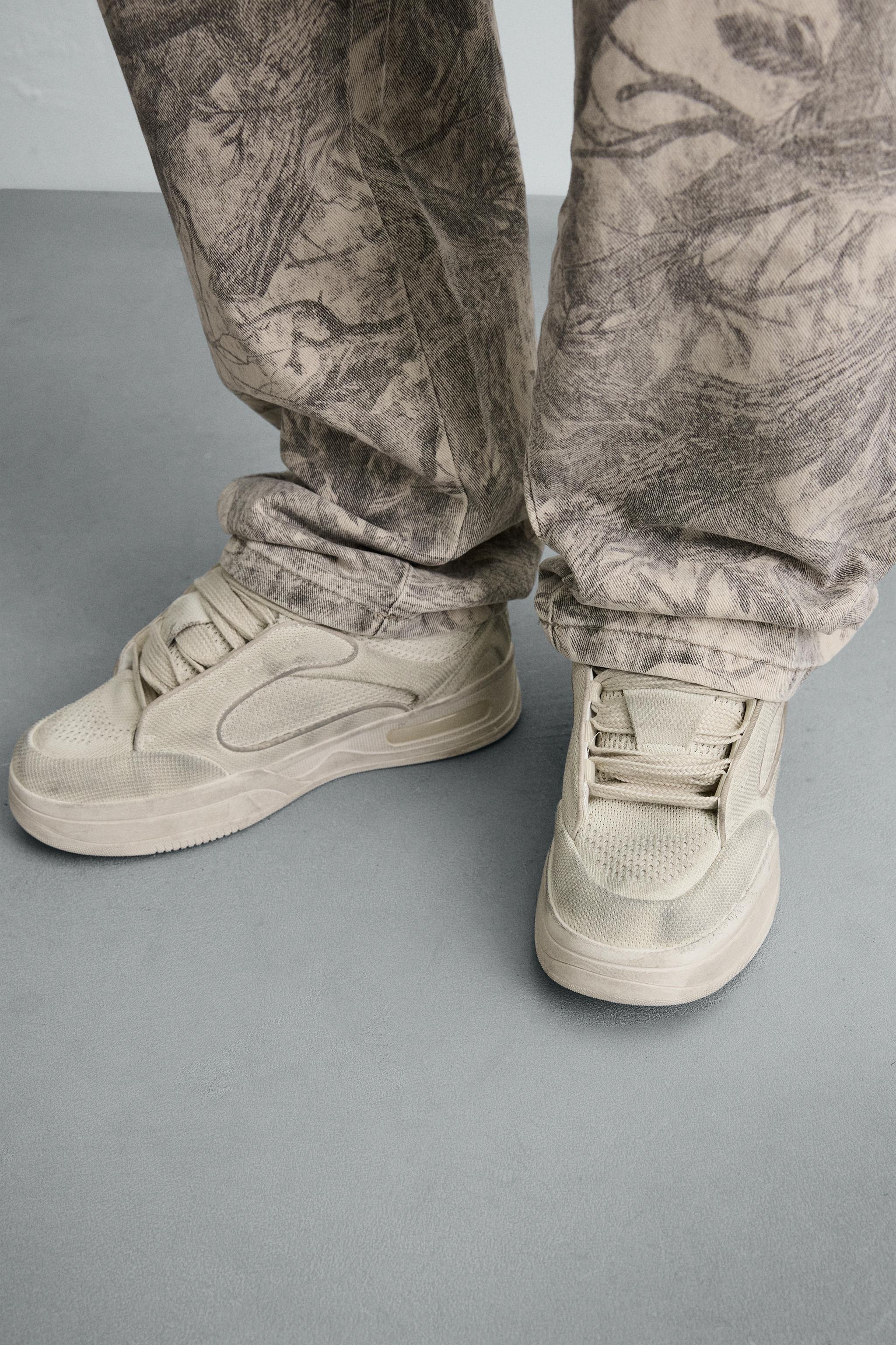DISTRESSED THICK-SOLED SNEAKERS