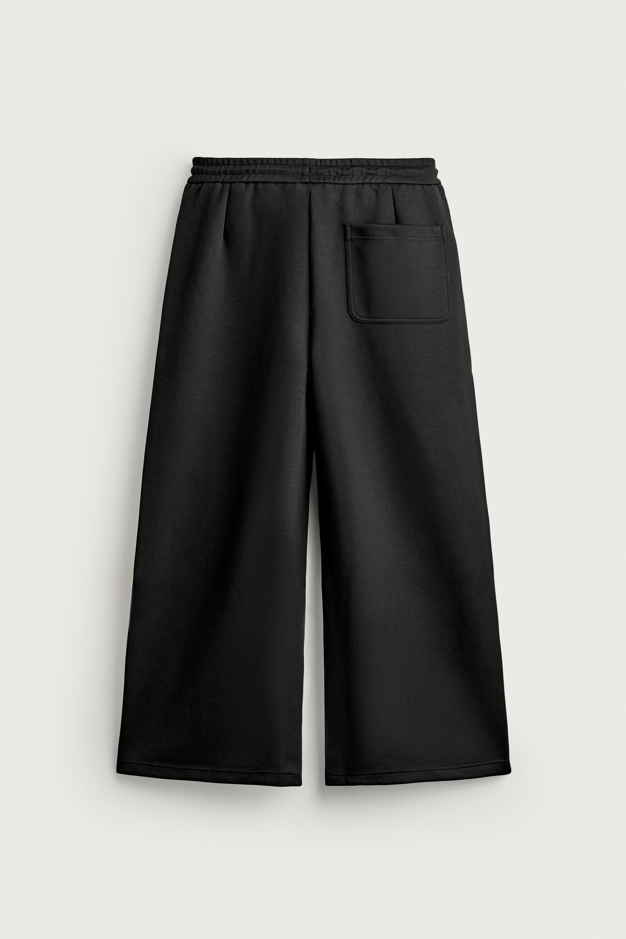 PLEATED BALLOON-FIT PANTS