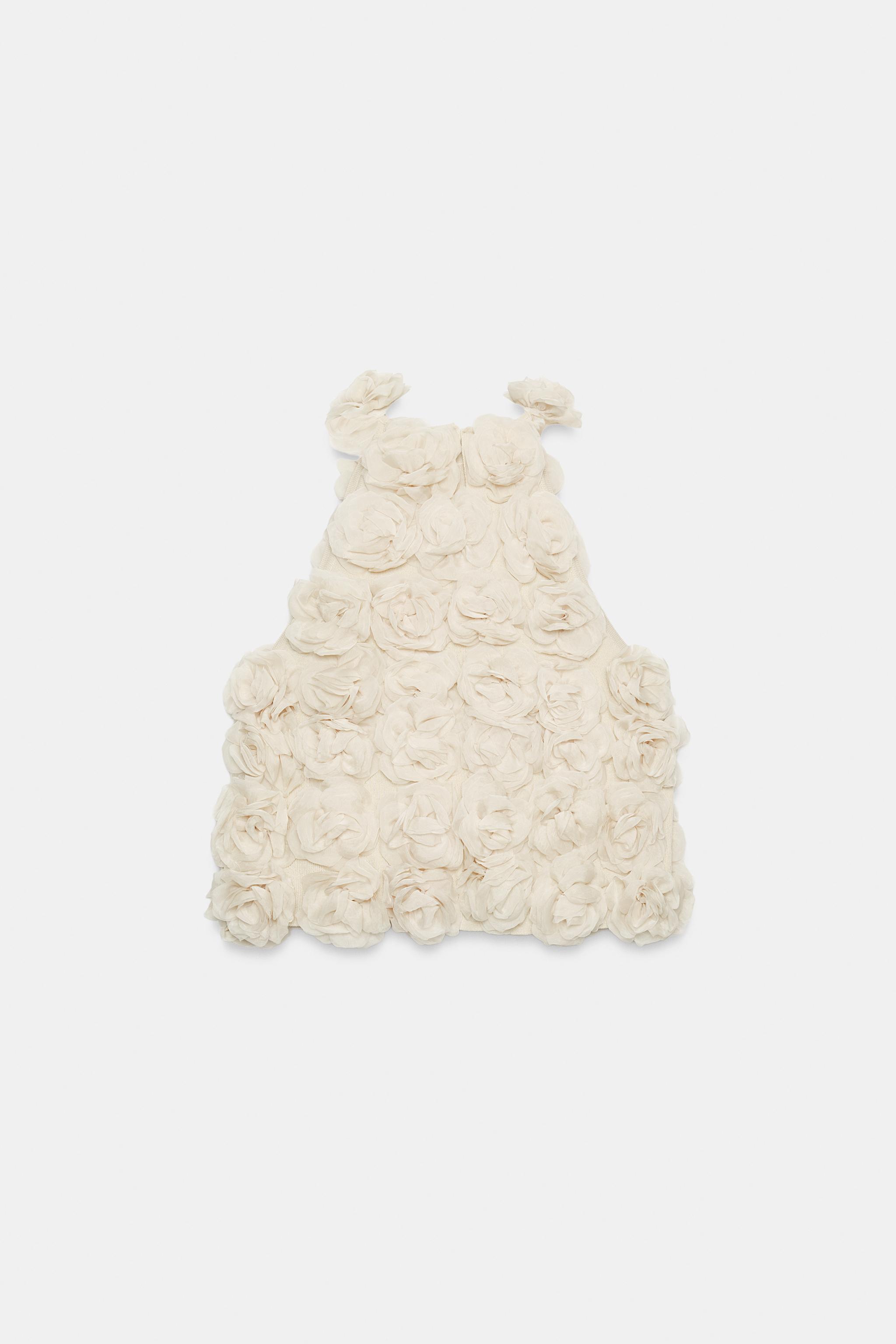 TOP HALTER EN MAILLE STRUCTURÉE FLEURIE
