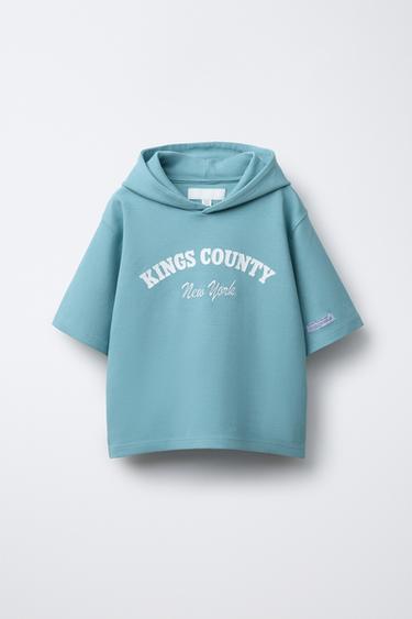 SWEATSHIRT MET KORTE MOUWEN, CAPUCHON EN TEKST - Blauw van Zara