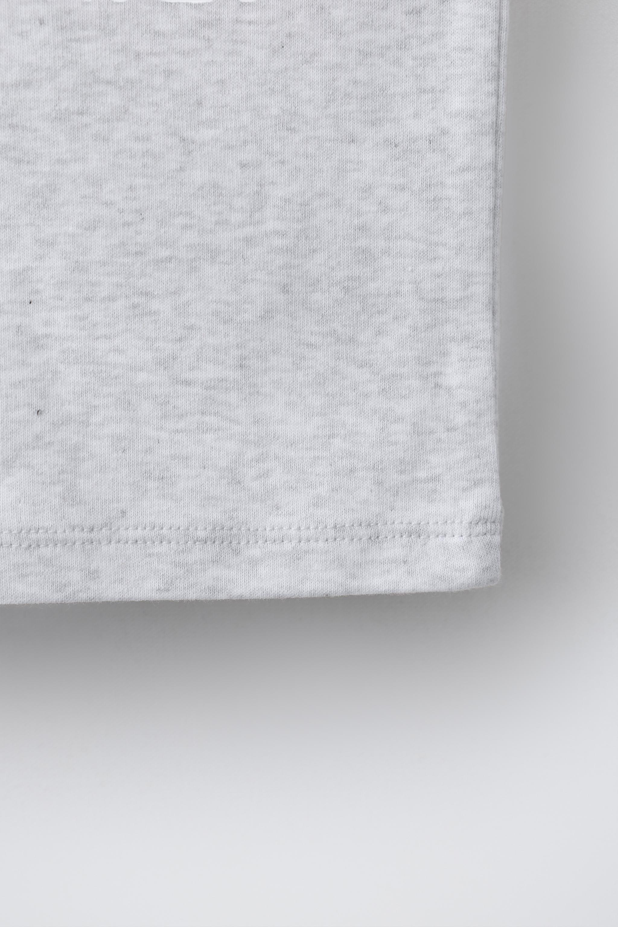 ASYMMETRIC BUCKLE TOP — Gray marl