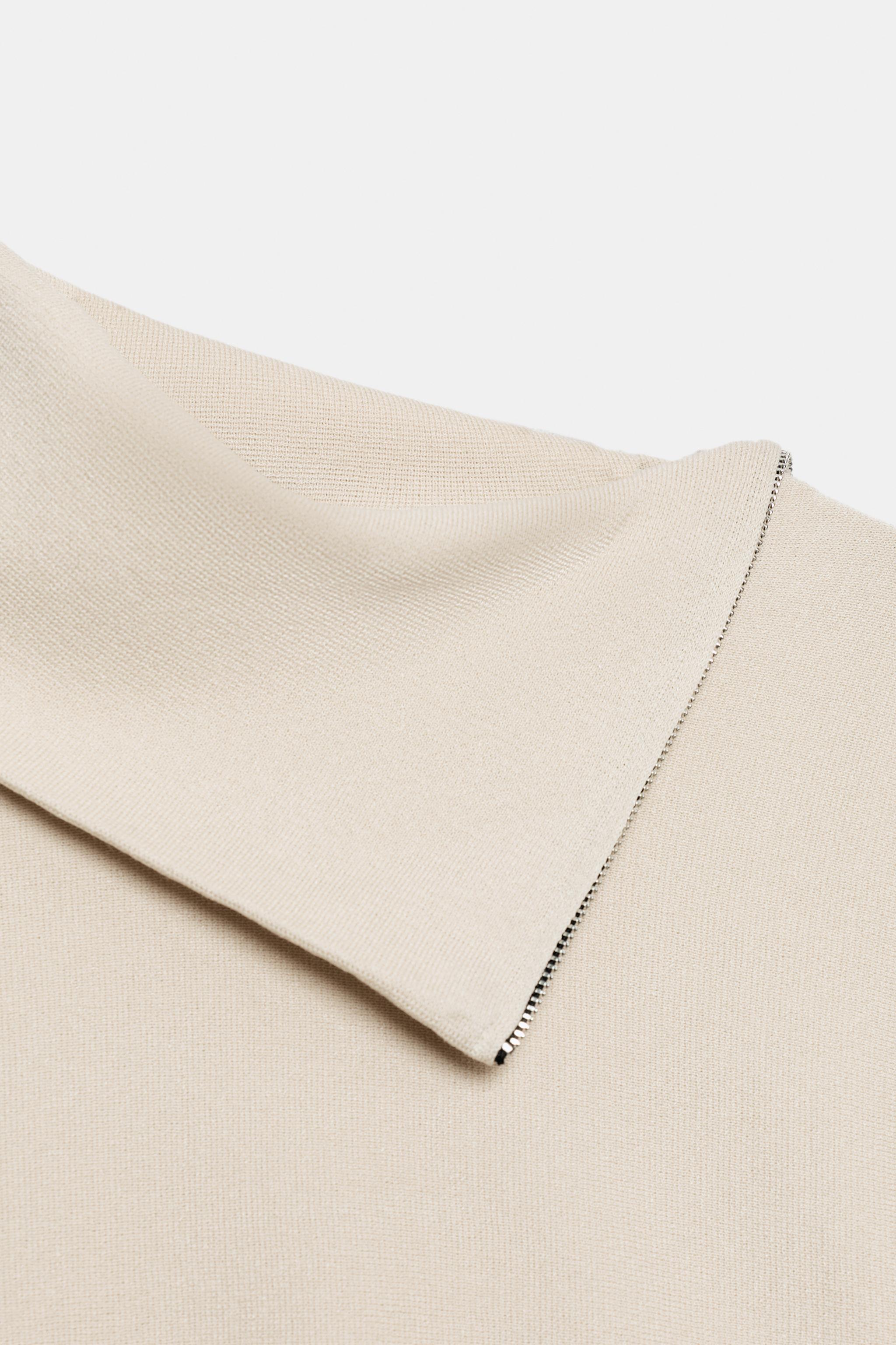 PULL EN MAILLE À ZIP LATÉRAL