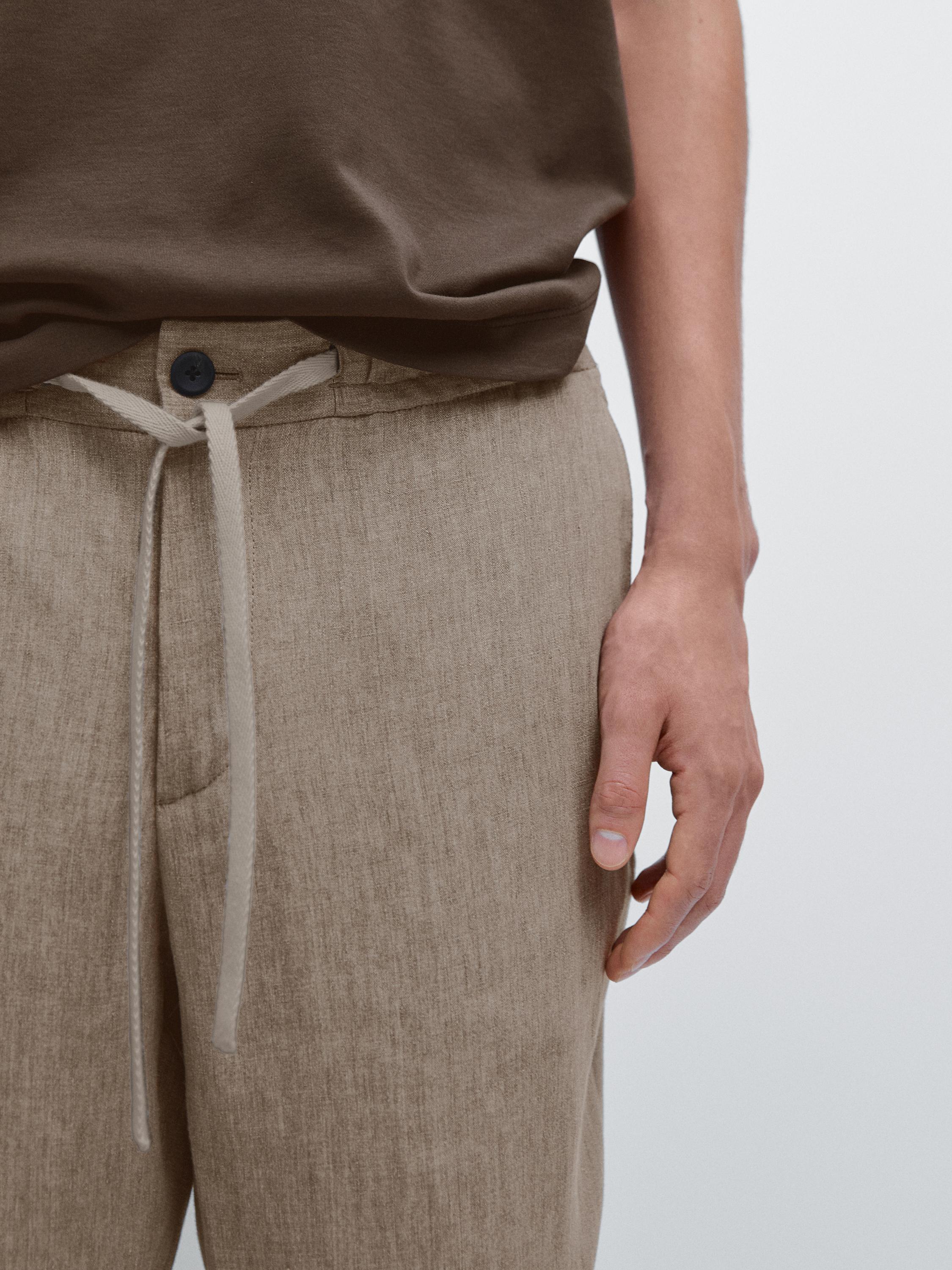 Faded total look linen trousers