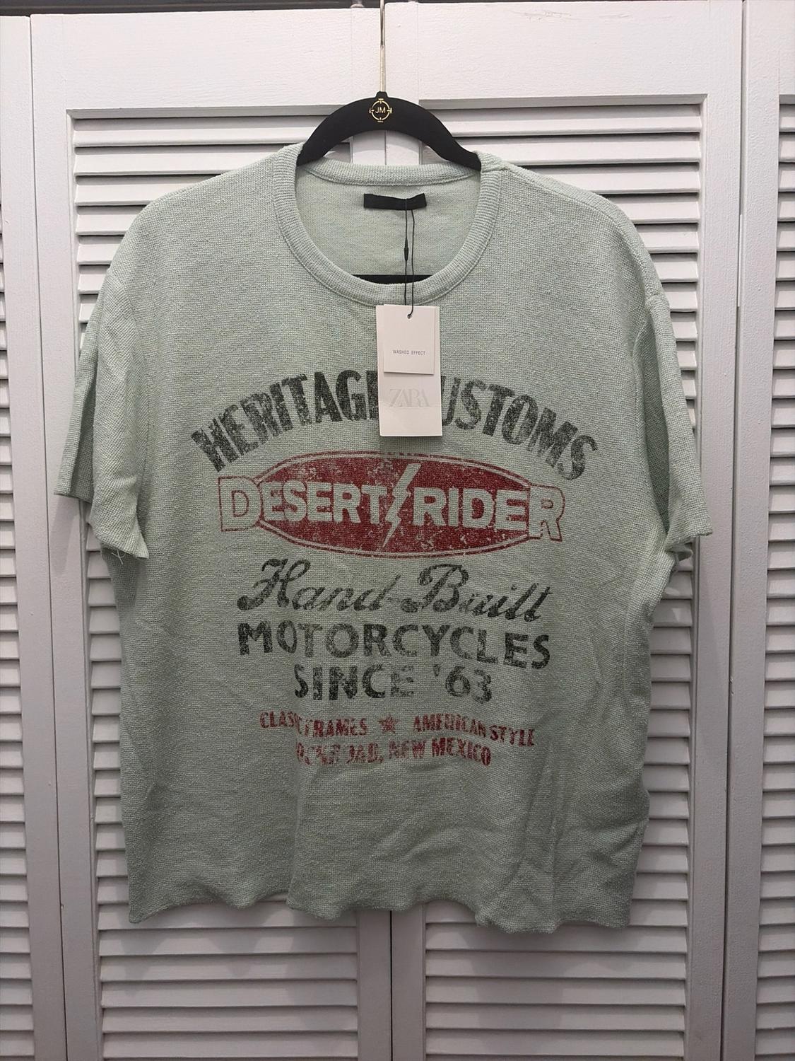 Green T-shirt with text: CUSTOMS DESERT RIDER Hand Built MOTORCYCLES SINCE '63 CLASSIC FRAMES AMERICAN STYLE OFF ROAD, NEW MEXICO.