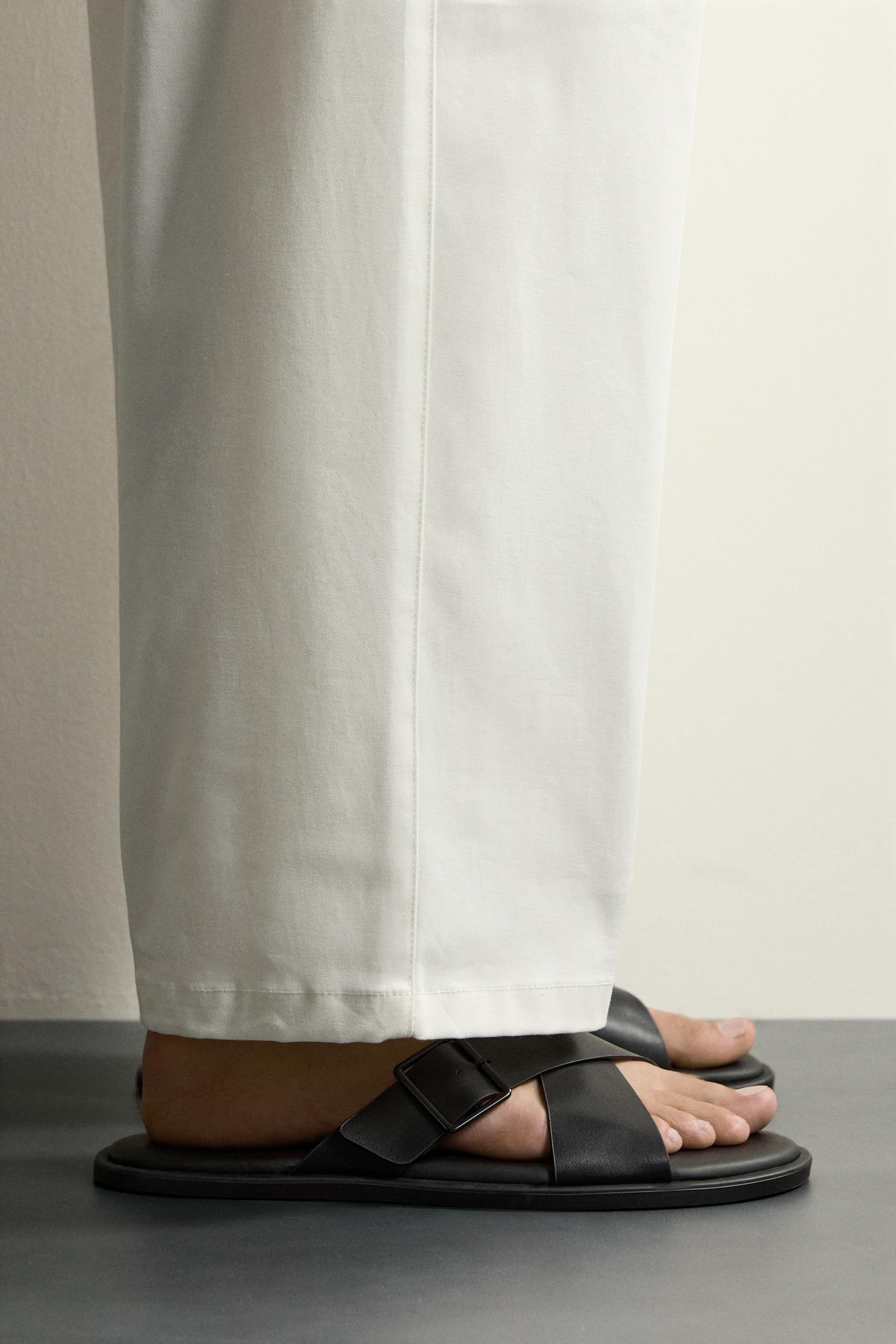 BUCKLED CRISSCROSS SANDALS