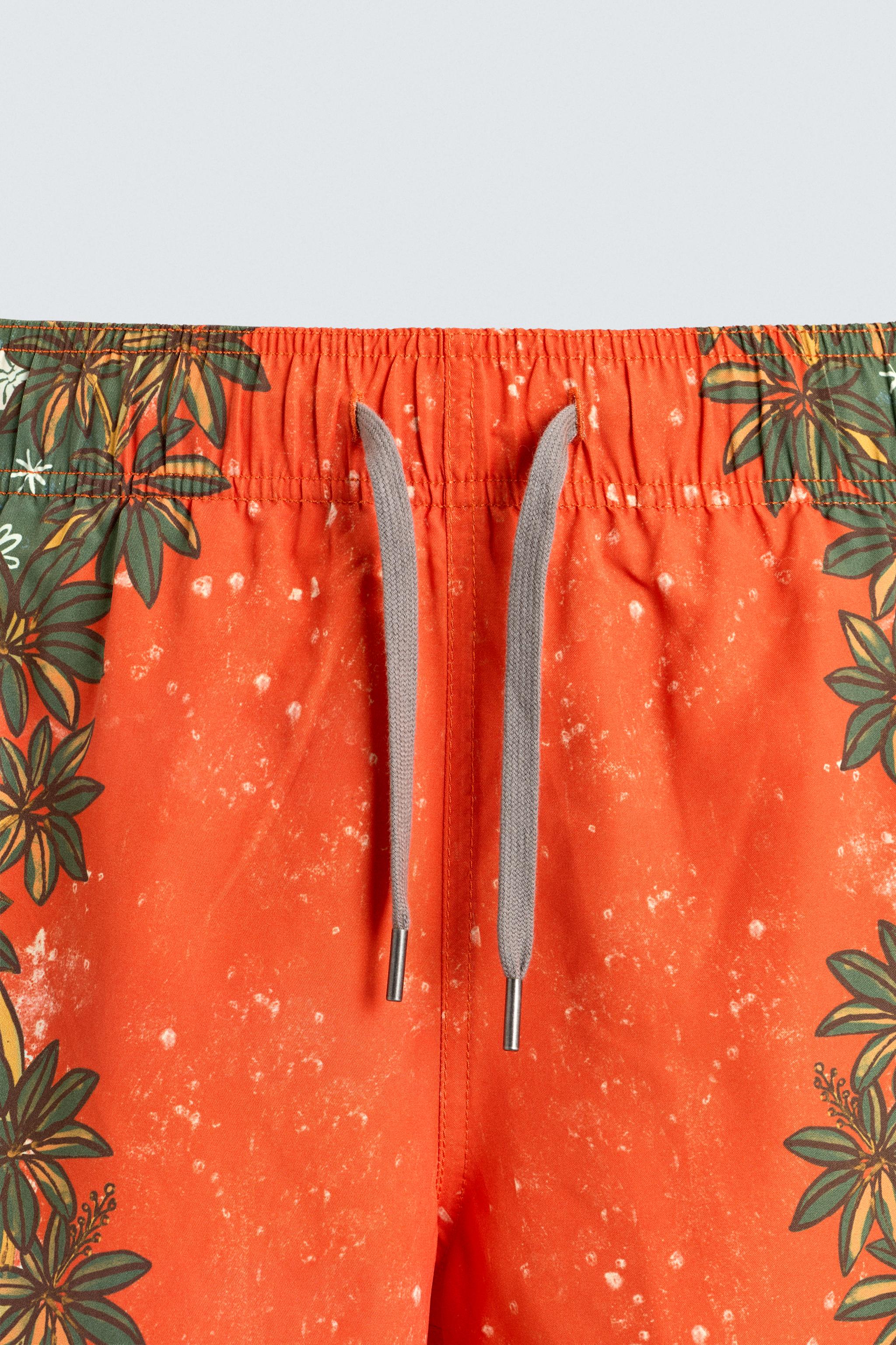 LONG FLORAL PRINT SWIM TRUNKS