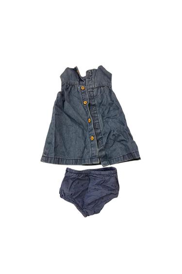 Front view of blue dress with buttons and matching nappy cover with star print.