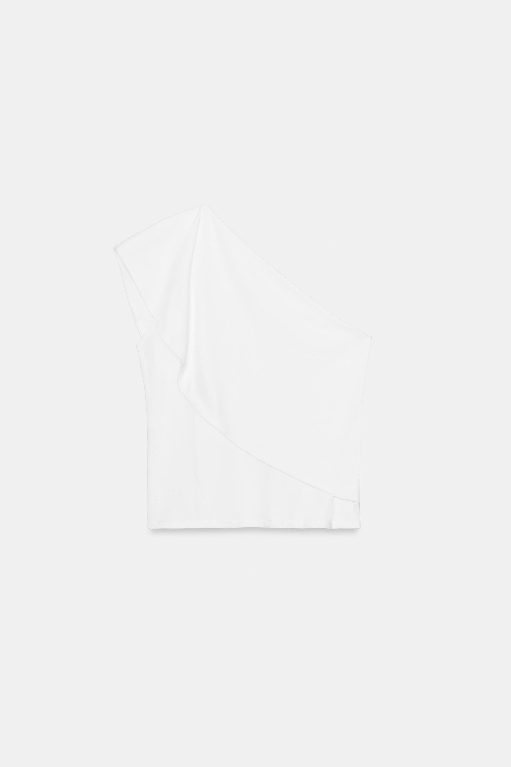 ASYMMETRIC INTERLOCK TOP
