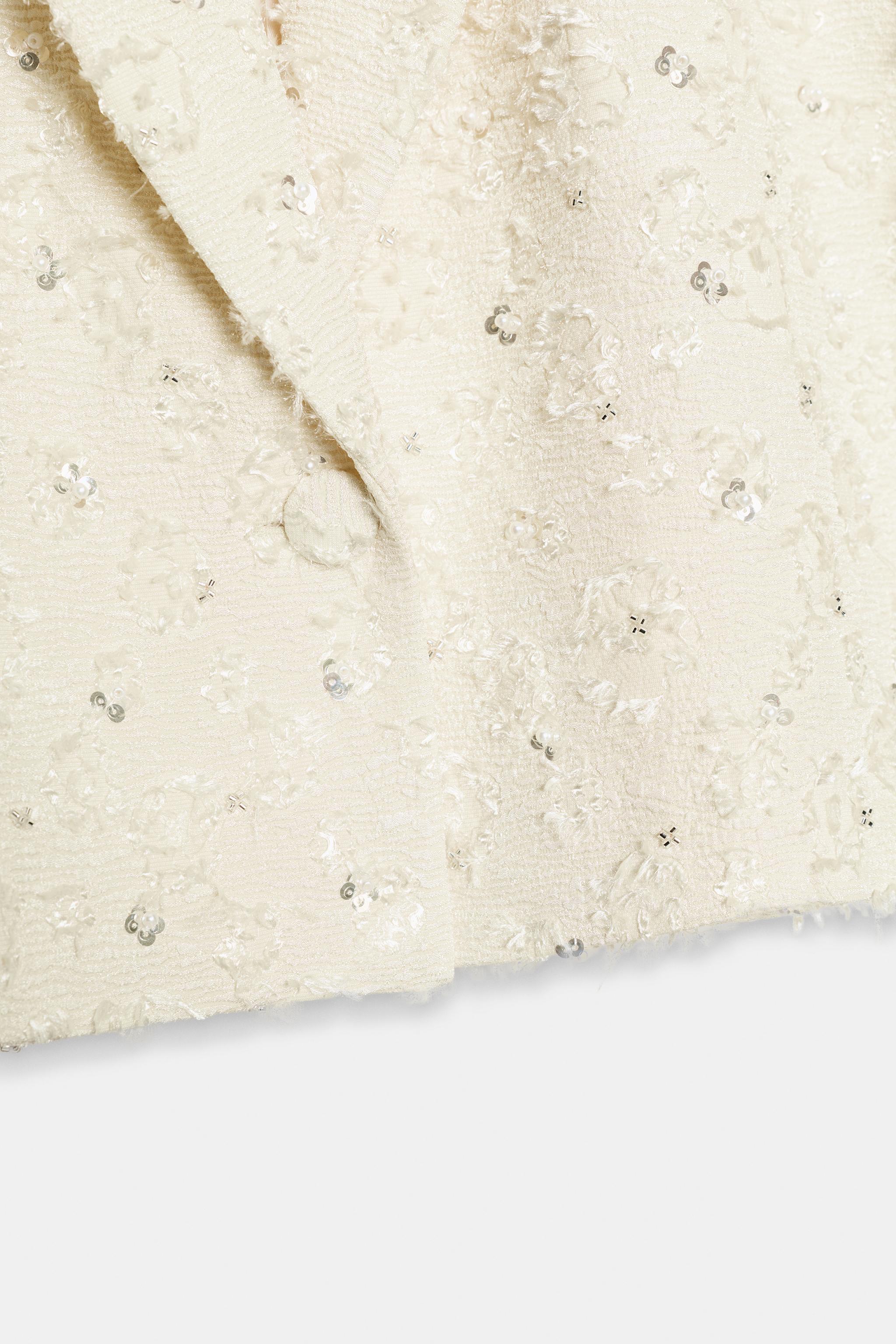 VESTE COURTE EFFRANGÉE À FANTAISIE