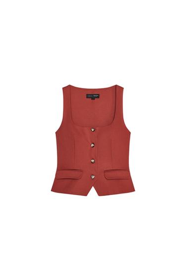 Front view of a red waistcoat with buttons and front pockets.