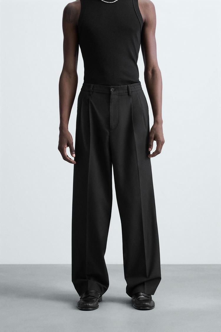 FLOWY PLEATED WIDE FIT PANTS