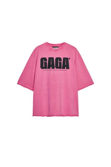 Front view of a pink short-sleeved T-shirt with the text "GAGA" on the chest and a round neck.