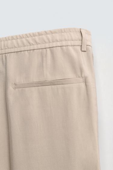 FLOWING PLEATED TROUSERS - Light beige by Zara - Image 9