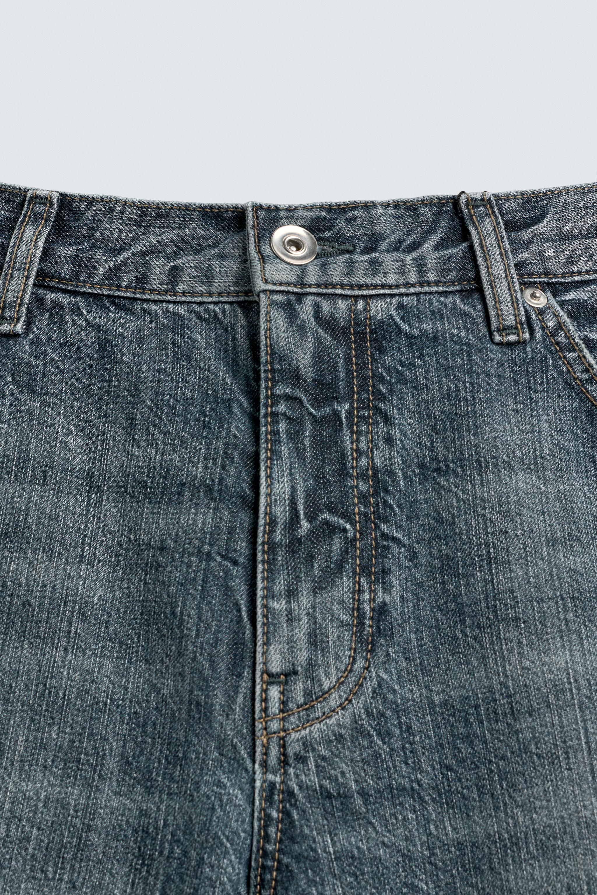 JEAN DROIT BOOTCUT À OUVERTURES