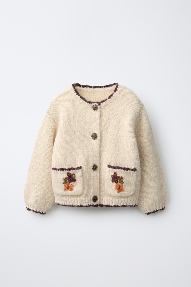Chaqueta punto bolsillos flores bordadas