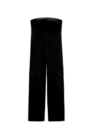 Front view of black pants with large side pockets.