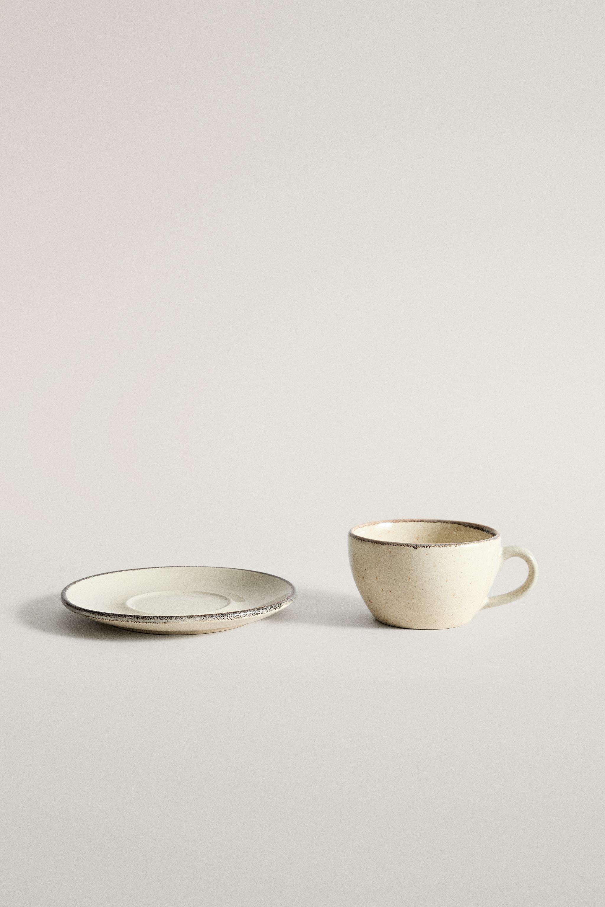 STONEWARE TEACUP AND SAUCER