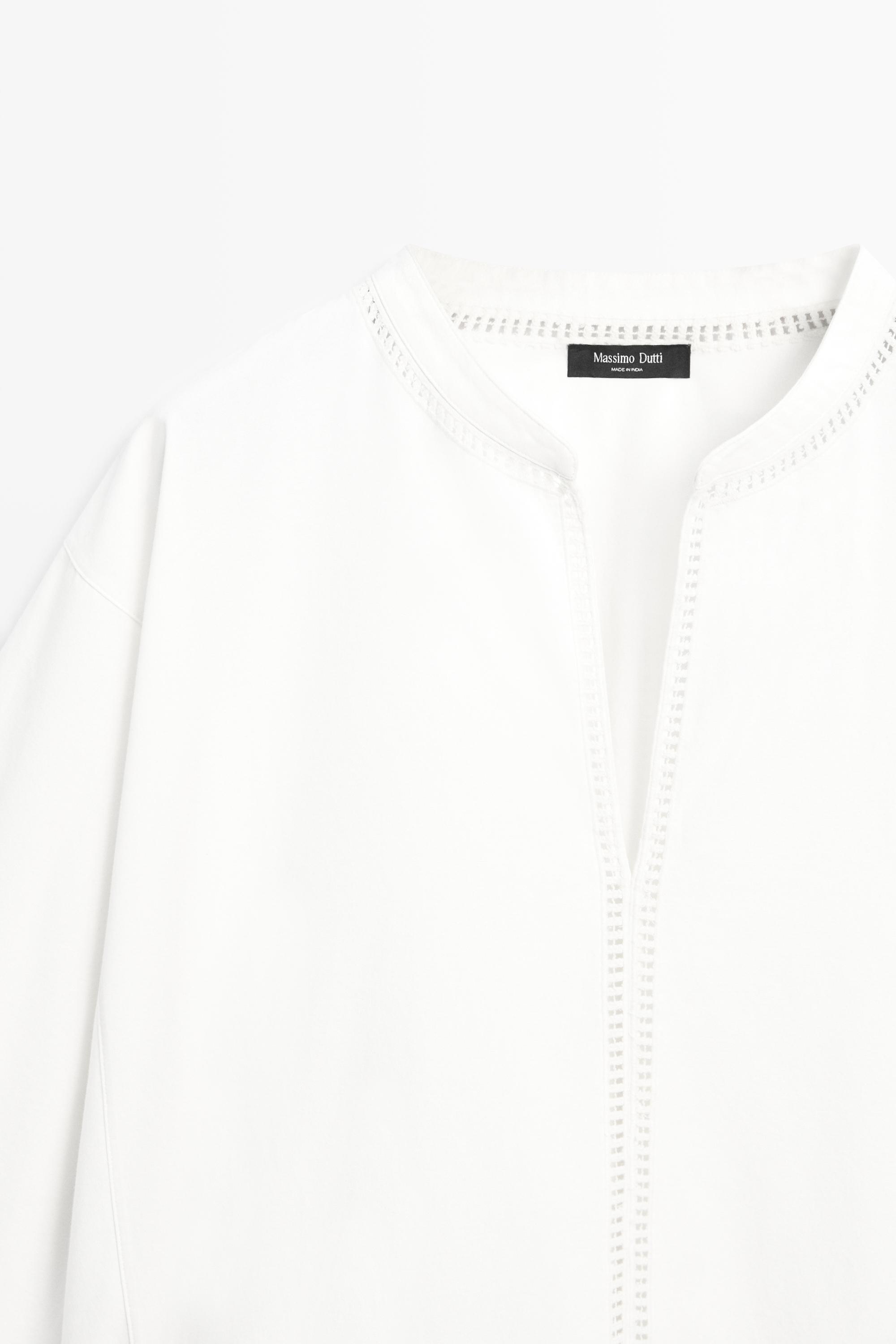 Embroidered blouse with fringed hem