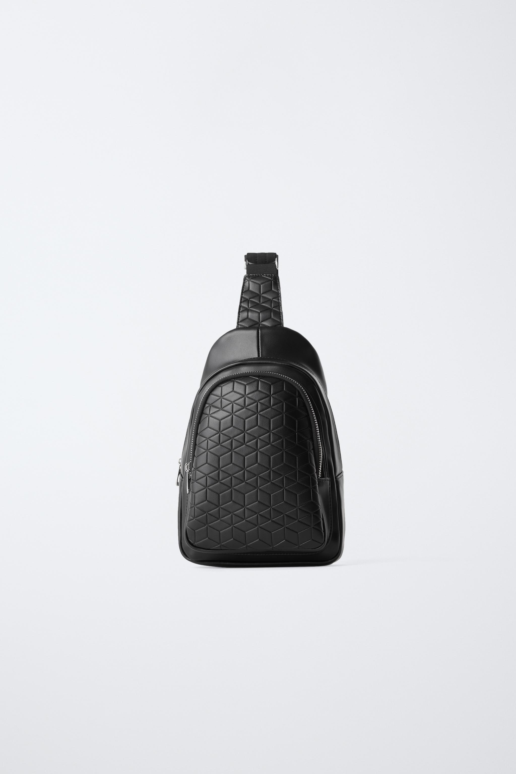 EMBOSSED CROSSBODY BACKPACK