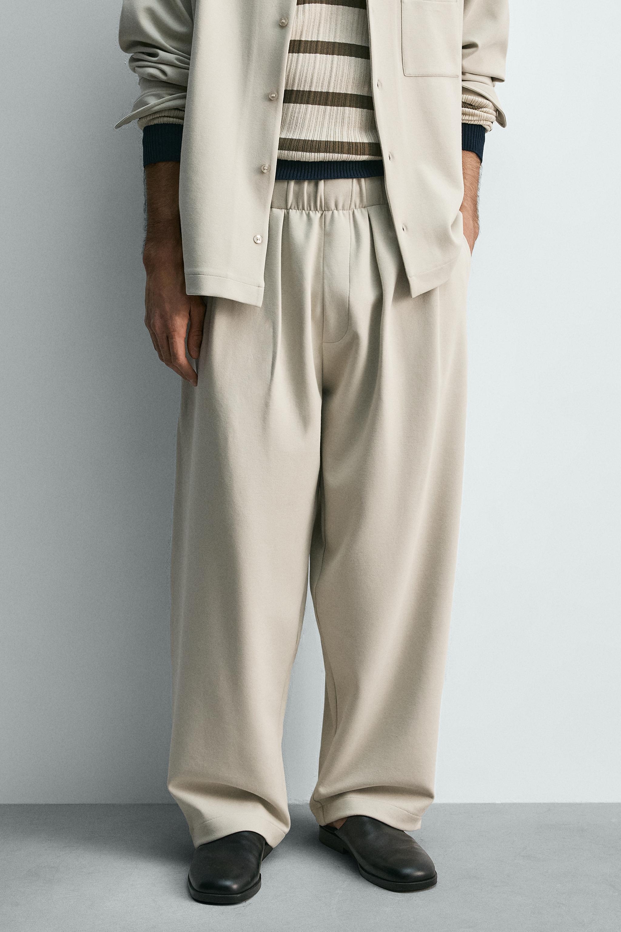 INTERLOCK PLEATED PANTS