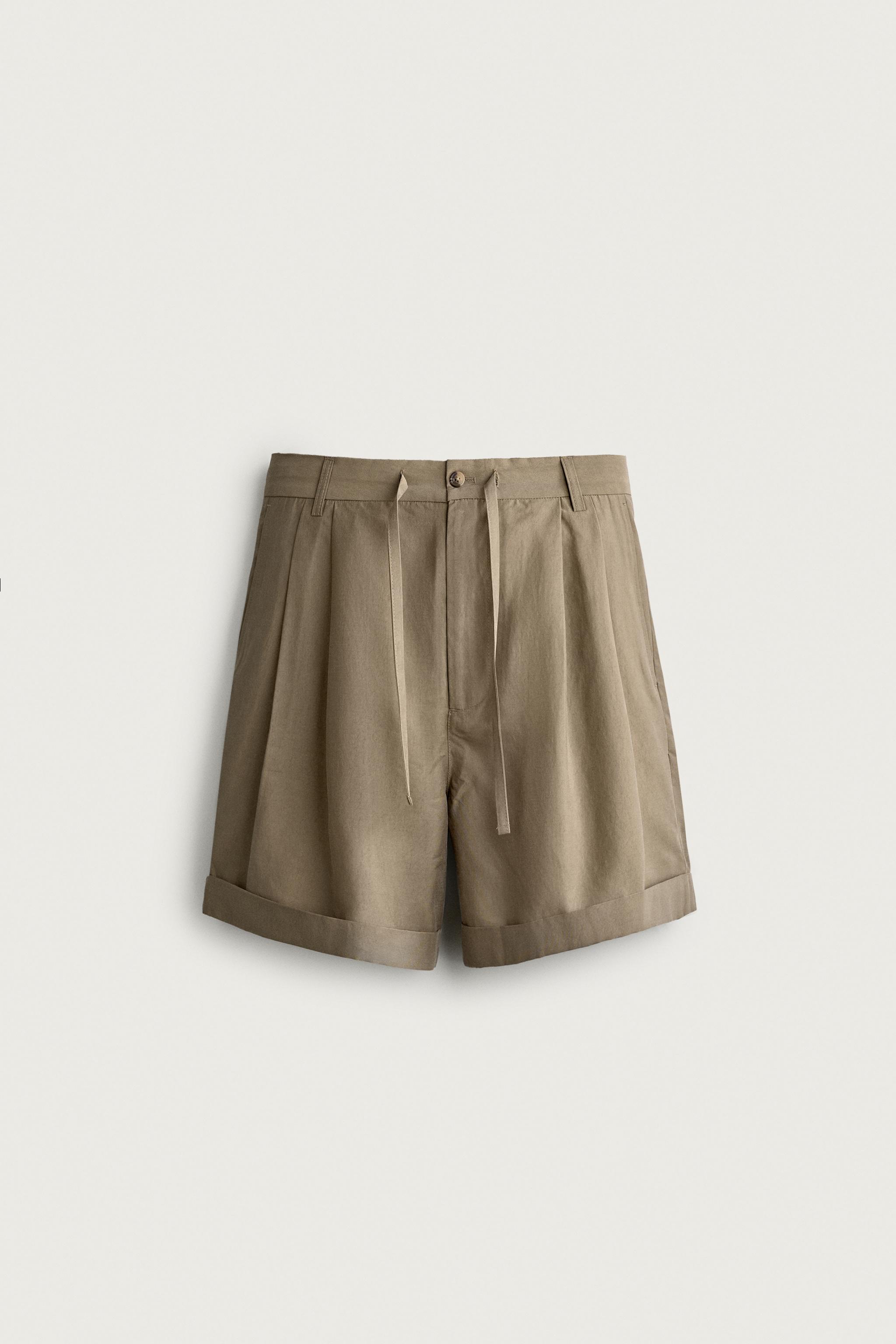 FLUID RELAXED FIT PLEATED SHORTS — Beige