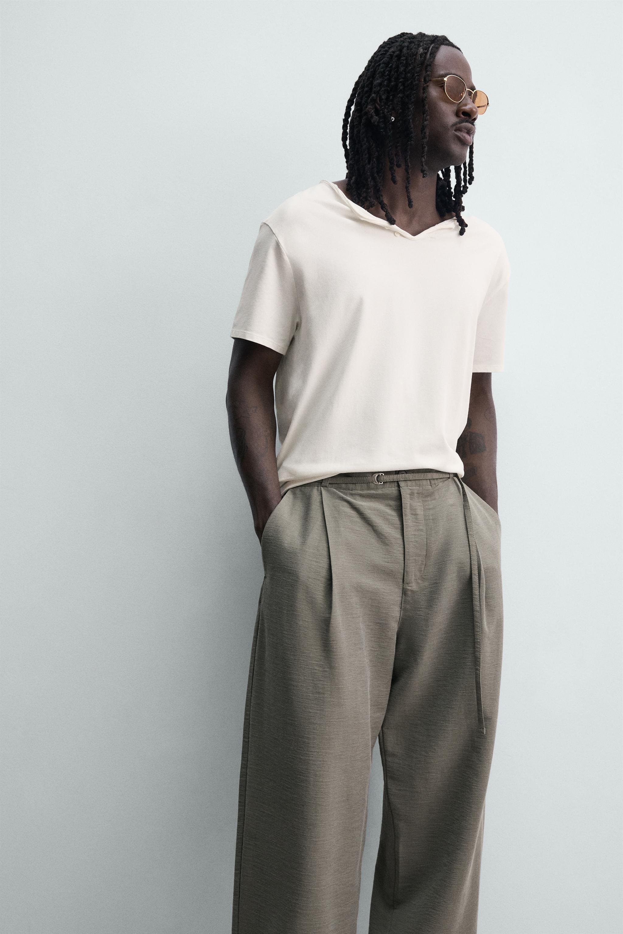 BALLOON FIT PLEATED BELTED PANTS