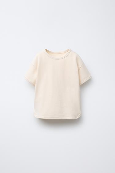 CAMISETA LISA VIVOS - Crudo de Zara