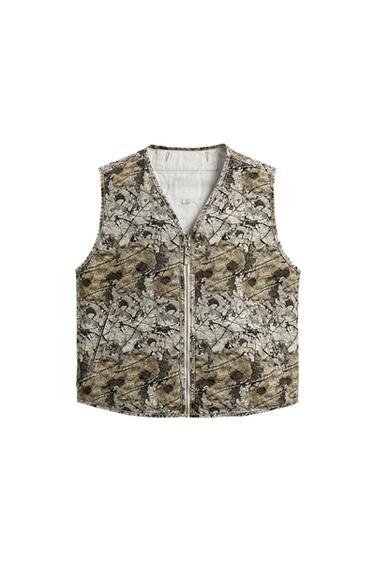 Front view of raw vest with abstract print, V-neck, front zipper closure and welt pockets at hip.