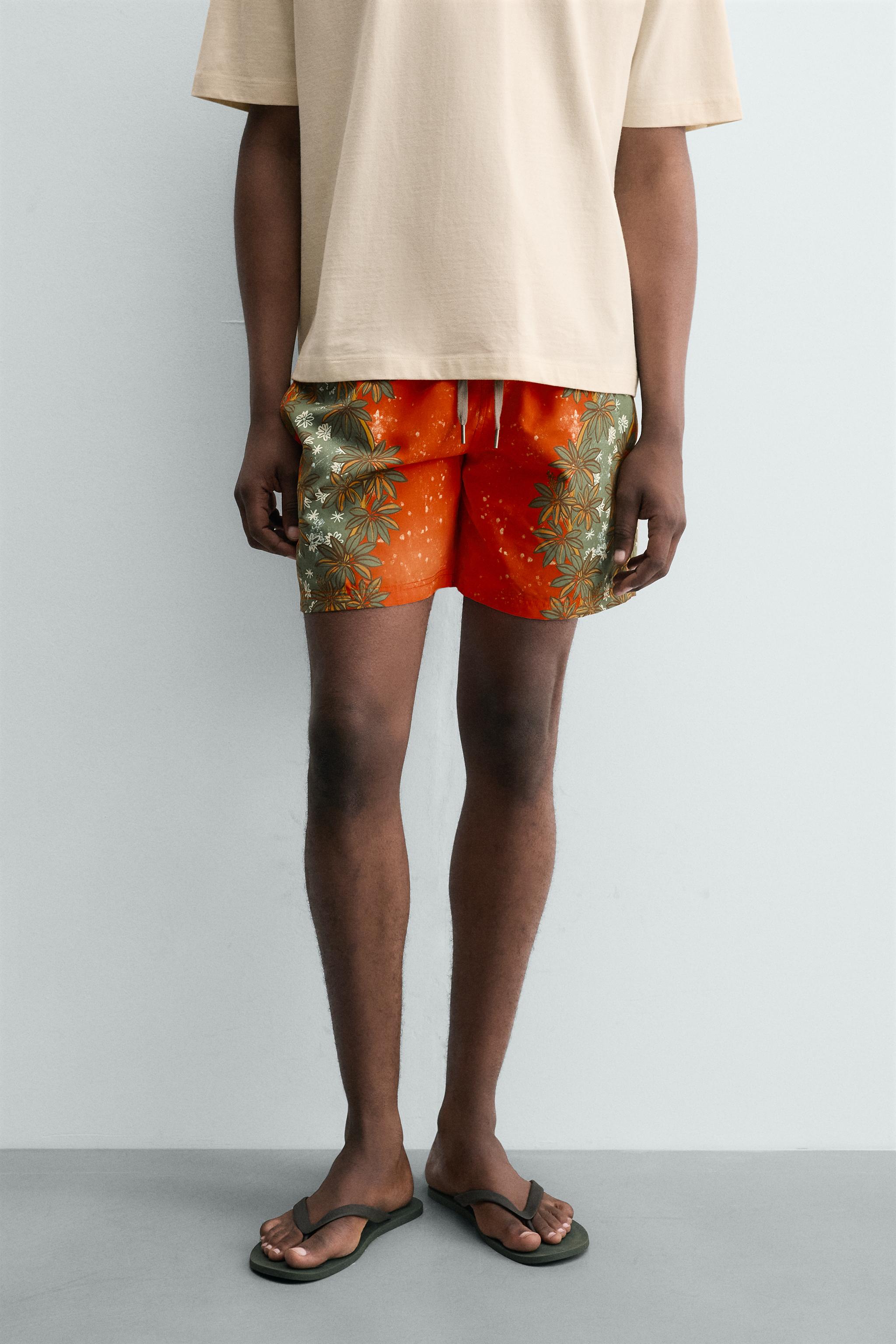 LONG FLORAL PRINT SWIM TRUNKS