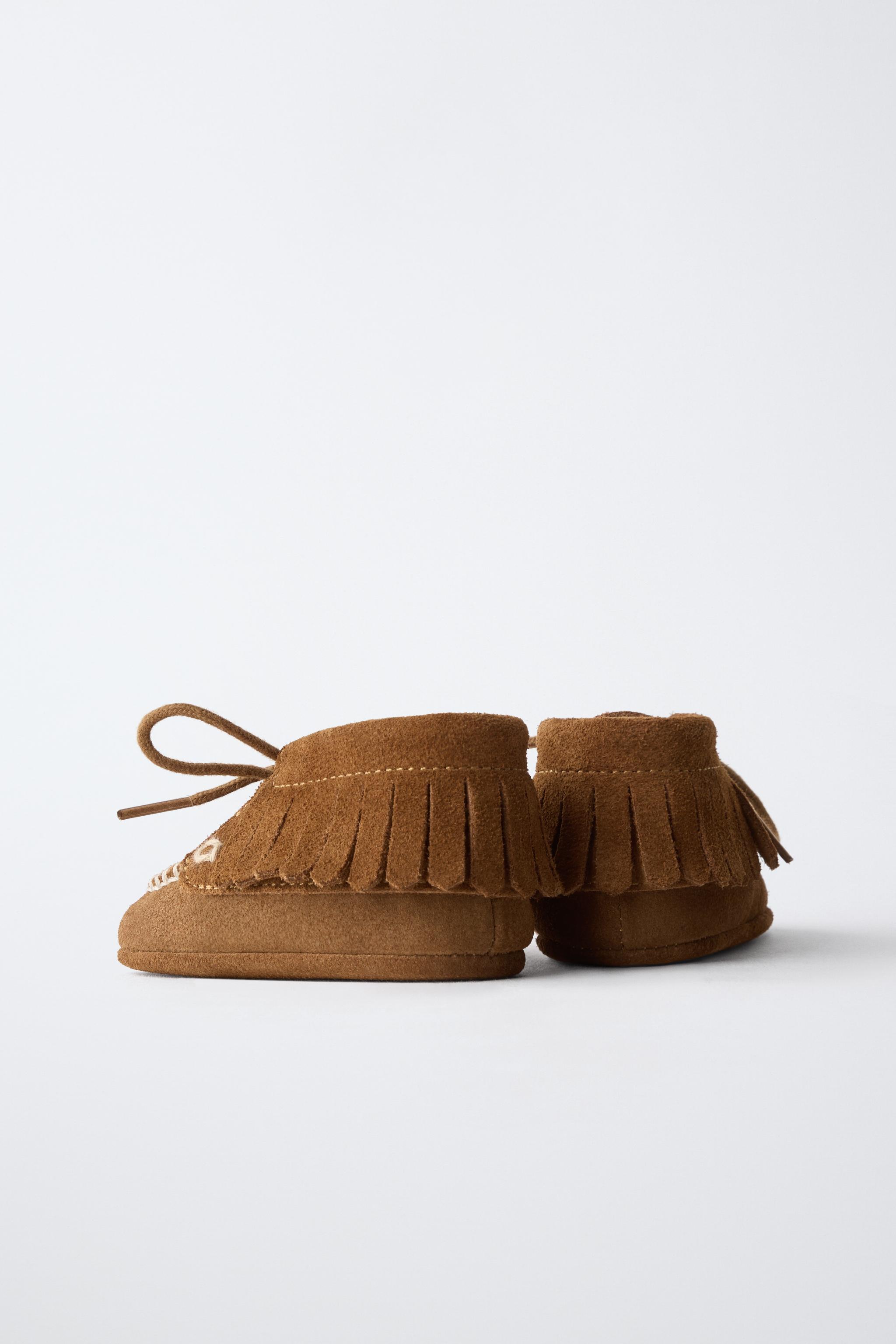 BOTTINES EN CUIR À FRANGES