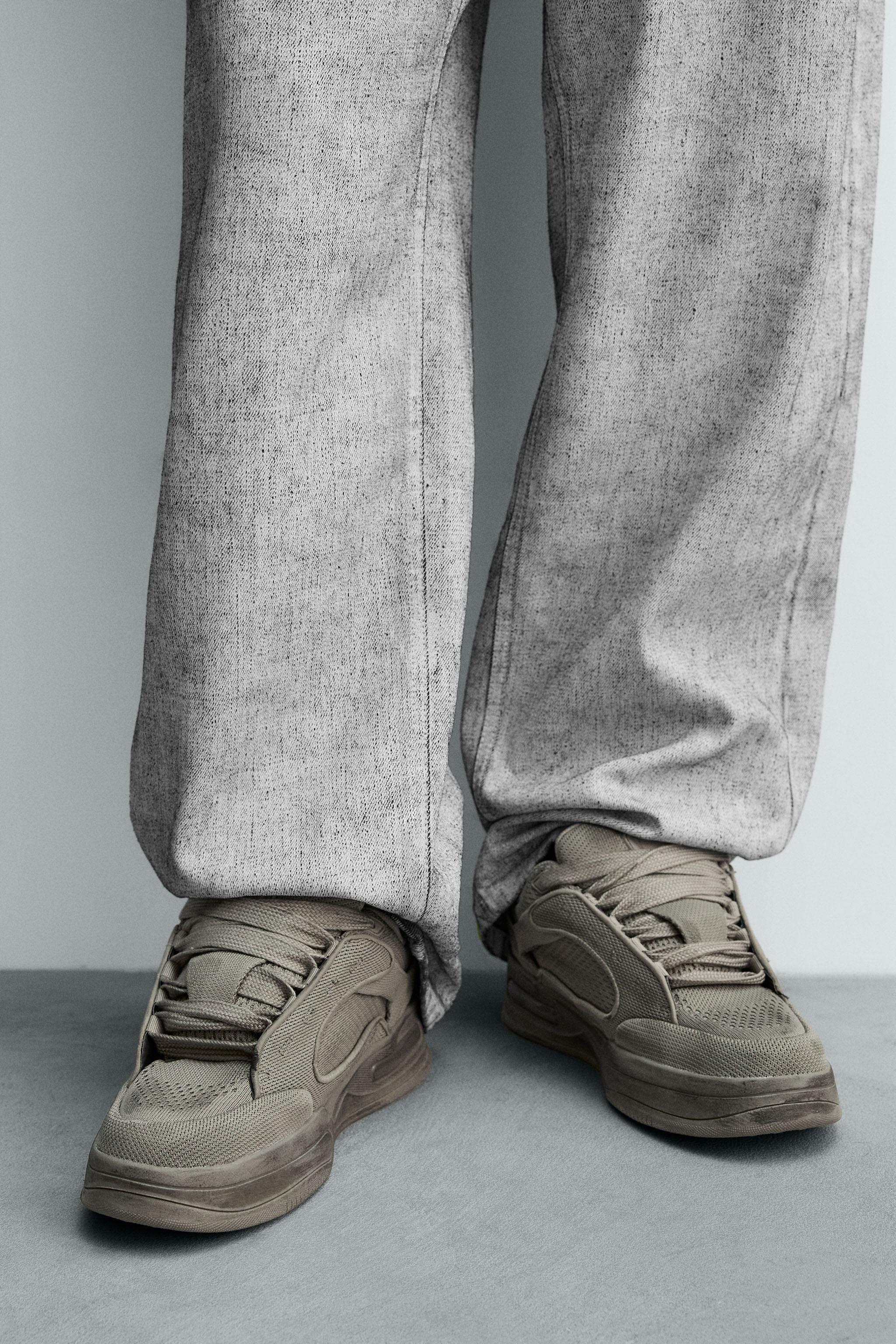 DISTRESSED THICK-SOLED SNEAKERS