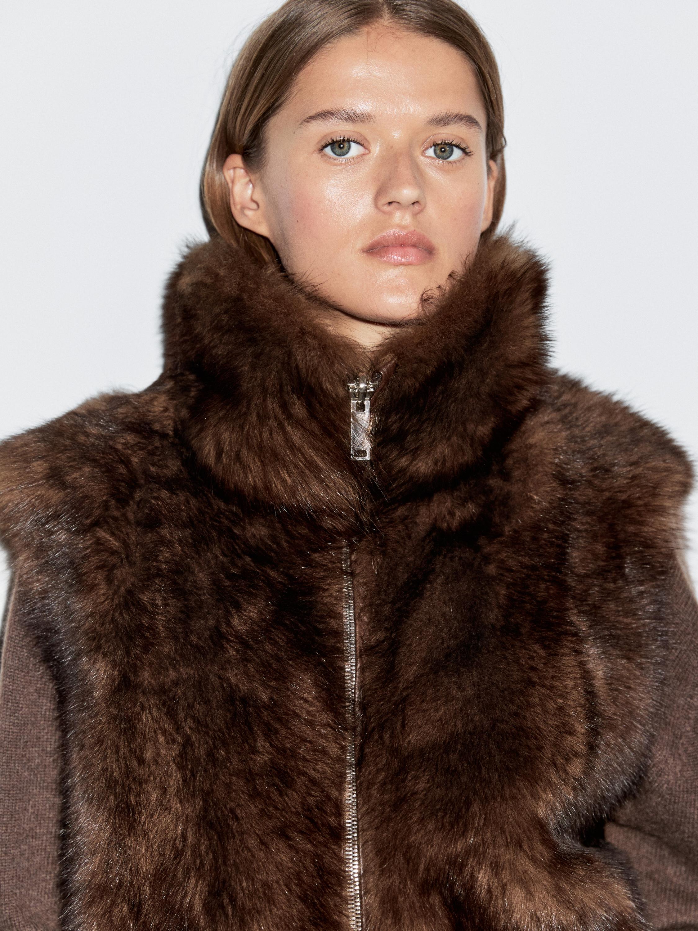 Leather high-neck waistcoat with fur