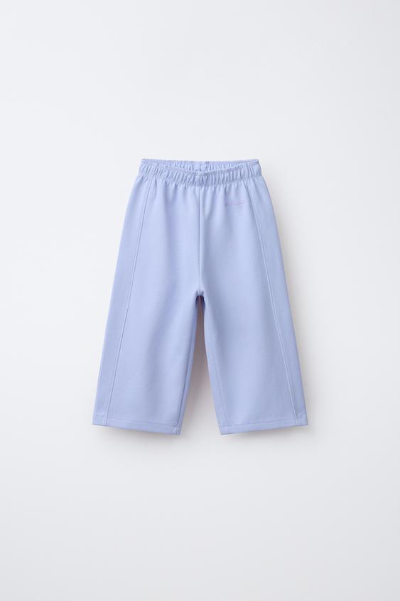 WIDE-LEG INTERLOCK TROUSERS WITH RAISED SLOGAN - Pastel blue by Zara - Image 0