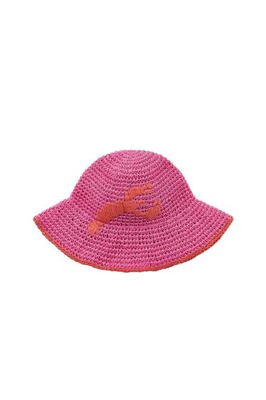 Pink woven-texture bucket hat featuring an embroidered orange lobster on the front, set against a white background.