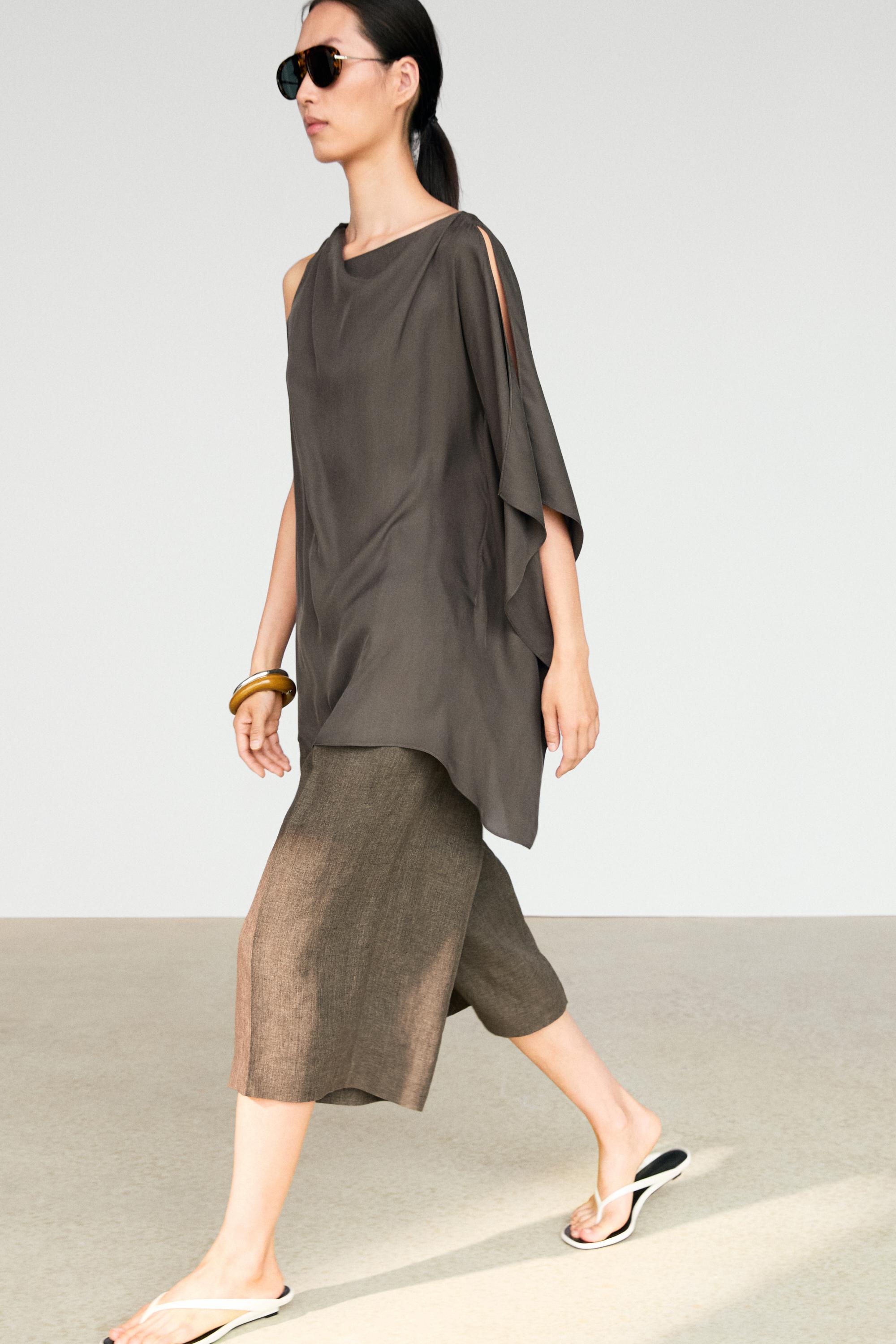 Asymmetric flowing cape top — Black gold
