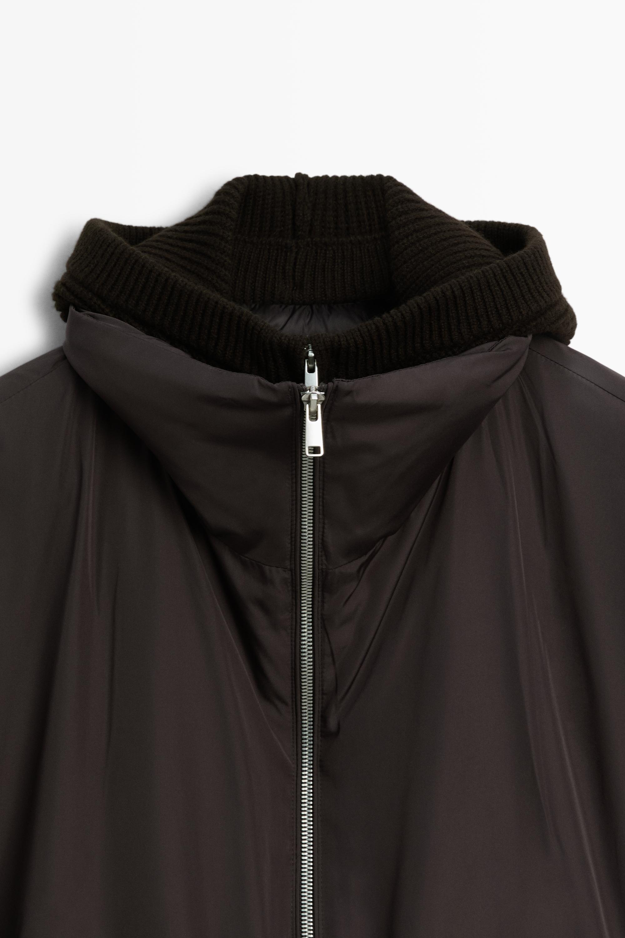 Down jacket with detachable detail piece