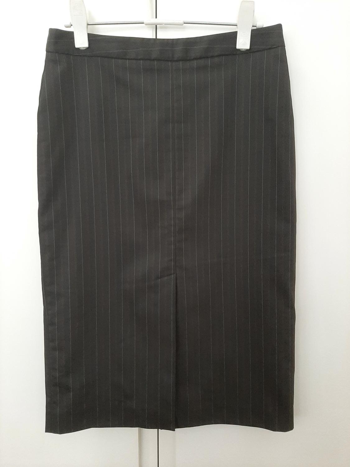 Front view of black skirt with thin vertical stripes