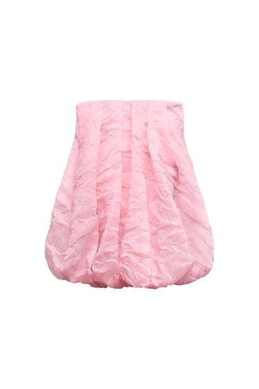 Pink skirt with a crinkled texture and a puffed design, front view on a white background.