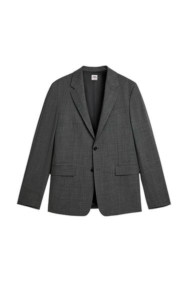 Front view of a grey jacket with classic lapels and two buttons. Visible front flap pockets.