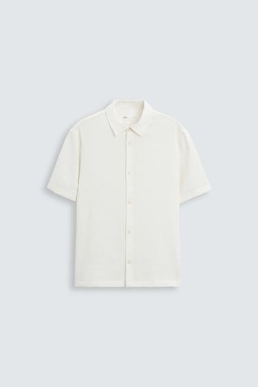 Zara Relaxed fit shirt made of cotton blend fabric. Lapel collar and short sleeves. Side vents at hem. Front button closure. - Ecru