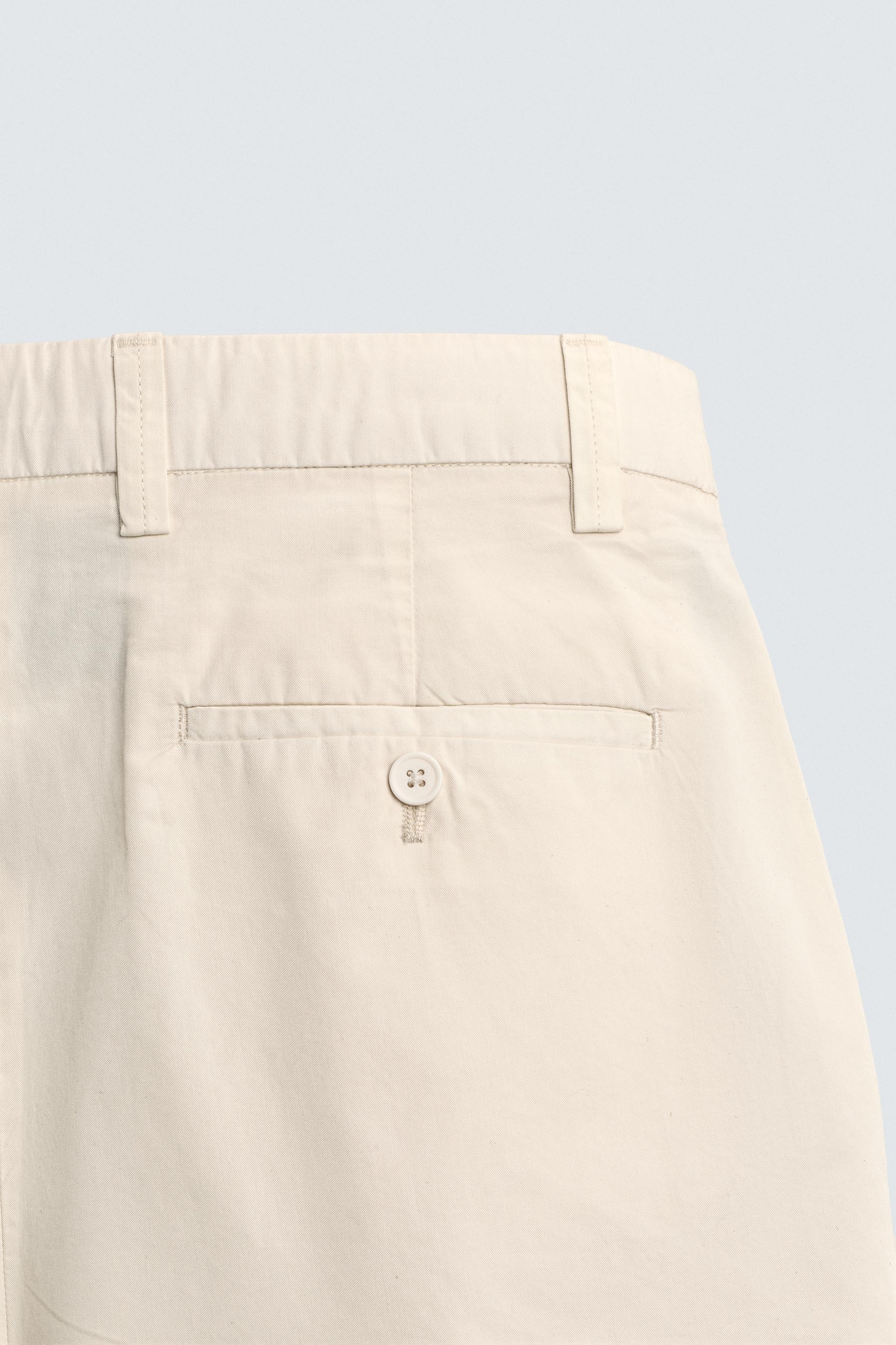 REGULAR FIT PLEATED SHORTS